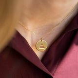 Image shows model wearing goldFour Elements Symbolic Balance Necklace