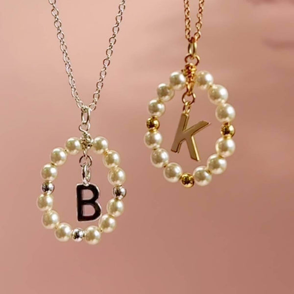 Image shows a Silver and gold Framed Pearl Initial Charm Necklace