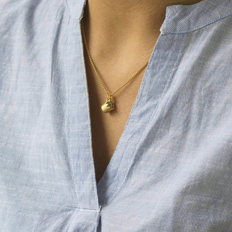 Image shows model wearing Gold Crown Birthstone Necklace