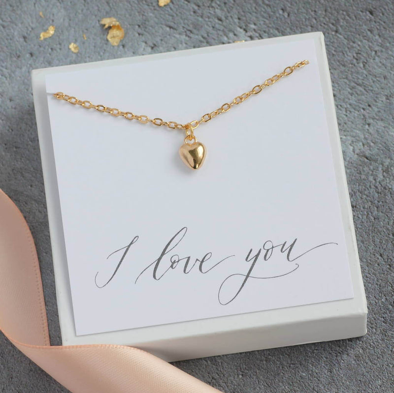 Image shows Gold Heart Charm Bracelet on a I love you sentiment card