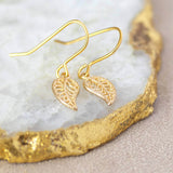  Image shows gold leaf filigree earrings