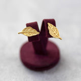 Image shows gold leaf stud earrings
