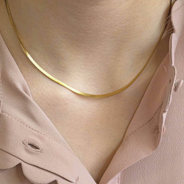 Image shows model wearing Gold Plated Base Layering Flat Snake Chain