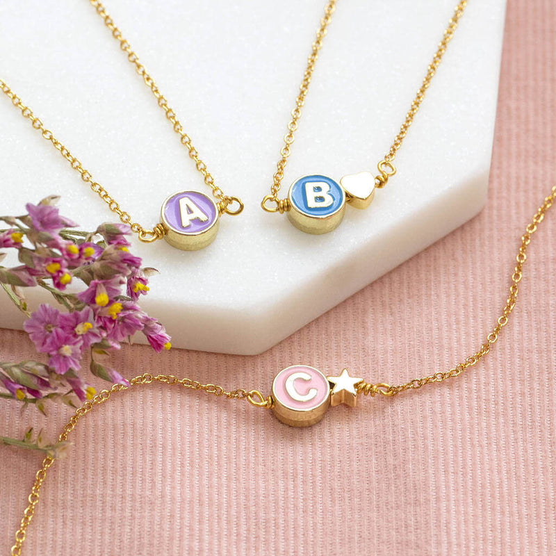 Image shows 3 Gold Plated Enamel Disc Initial Necklaces