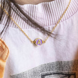 Image shows model wearing Gold Plated Enamel Disc Initial Necklace with the initial A