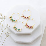 Image shows Gold Plated Rhombus And Birthstone Hoop Earrings with July and May birthstones