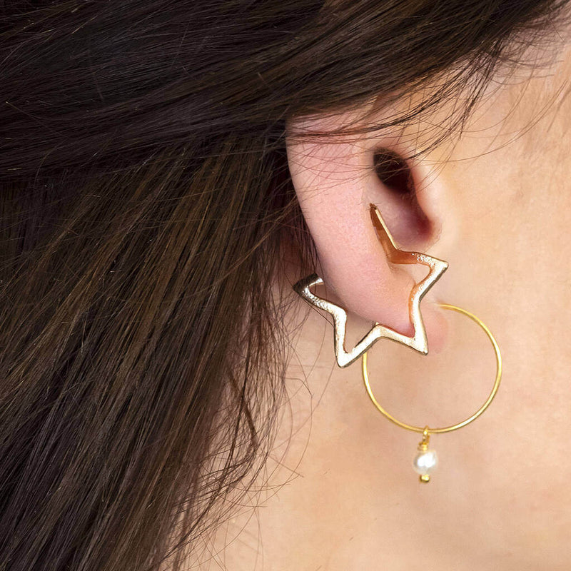 Image shows model wearing Gold Plated Star Ear Cuffs