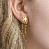 Image shows model wearing Gold Plated Star Earrings with Chain Drop Detail