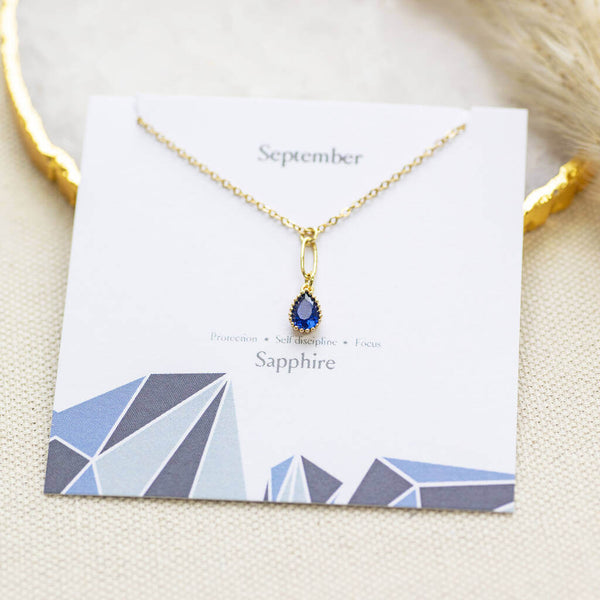Image shows September Gold Plated Teardrop Birthstone Pendant Necklace on  birthday characteristic card