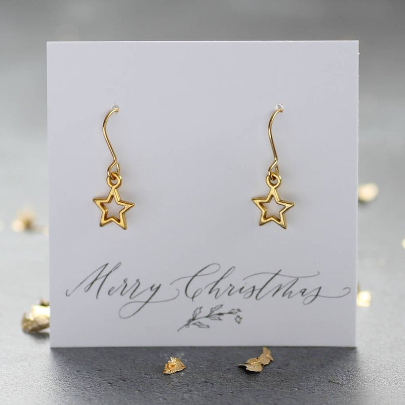 Image shows gold star earrings a merry Christmas sentiment card