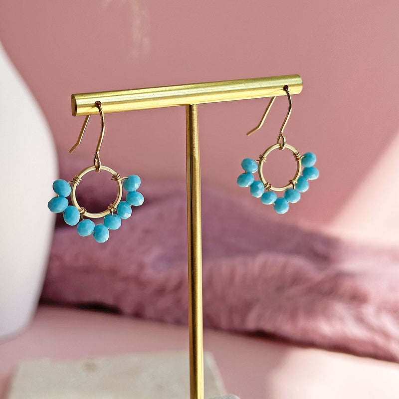Image shows Half Beaded Turquoise Circle Drops on gold earring holder