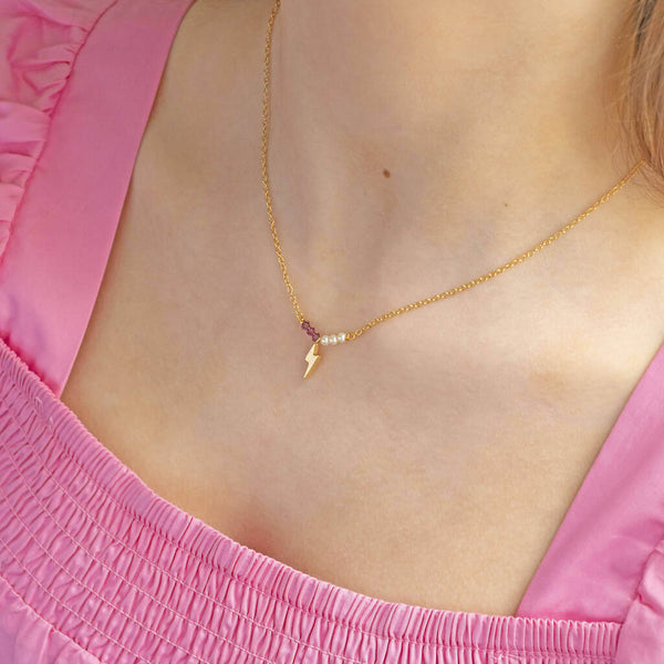 Image shows model wearing Lightning Bolt Birthstone and Pearl Bar Necklace