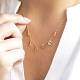 Image shows model wearing Limited Edition Love Charm Necklace