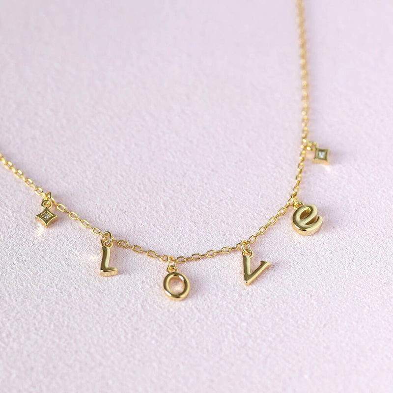 Image shows Limited Edition Love Charm Necklace on a white background