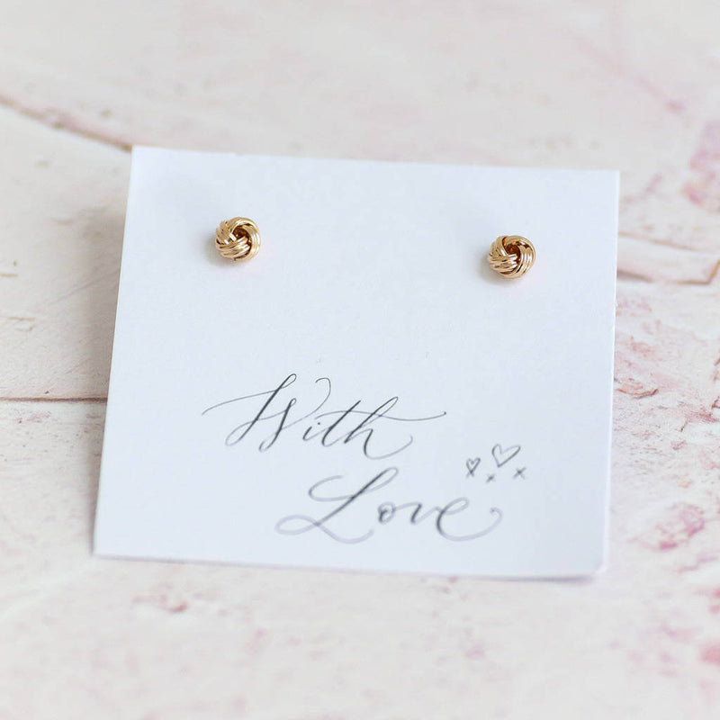 Image shows gold Love Knot Stud Earrings on a with love sentiment card