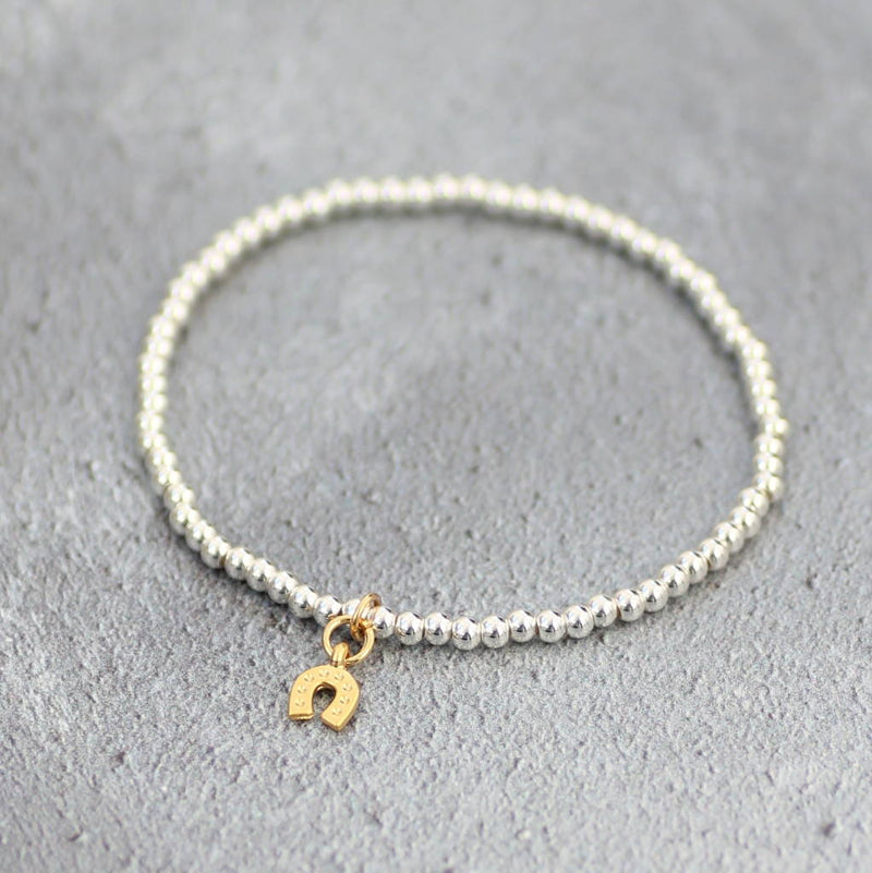 Image shows  lucky horseshoe beaded charm bracelet  Edit alt text