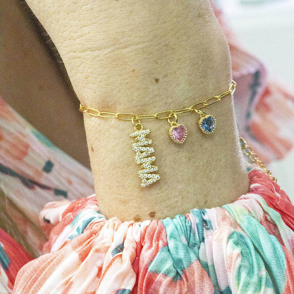 Image shows model wearing 'Mama' Charm Bracelet with Children's Birthstones