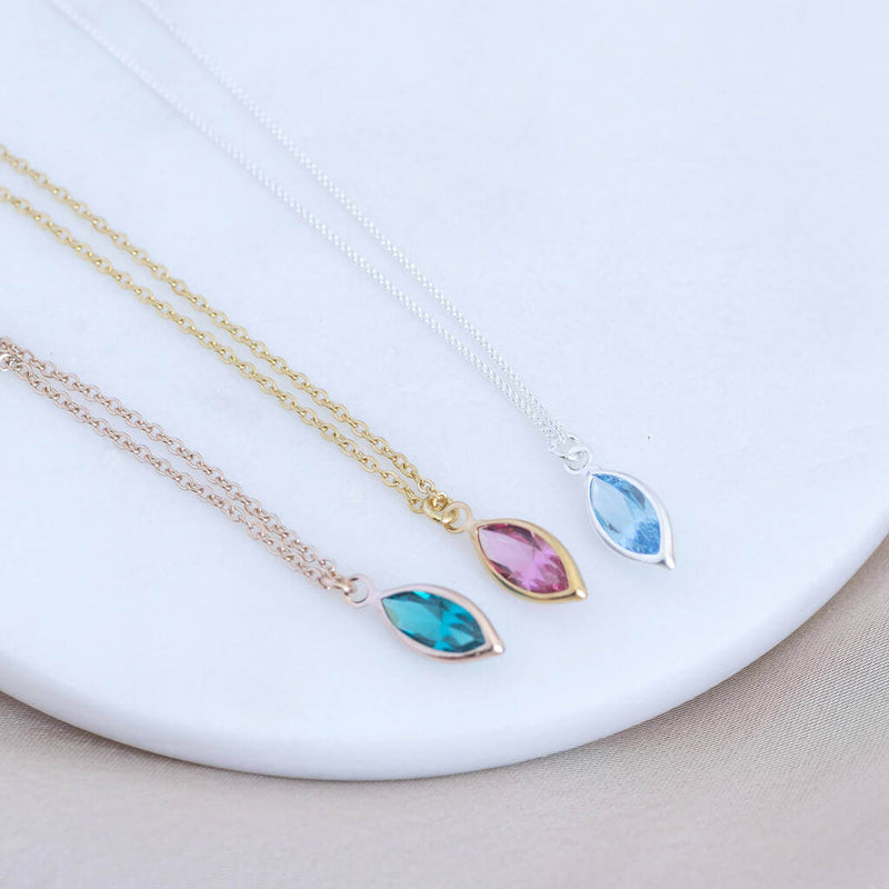 Image shows rose gold, gold and silver Image shows model holding gold Marquise Swarovski Crystal Birthstone Pendant Necklaces