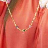Image shows model holding Mini Gold Plated Family Birthstone Link Necklace