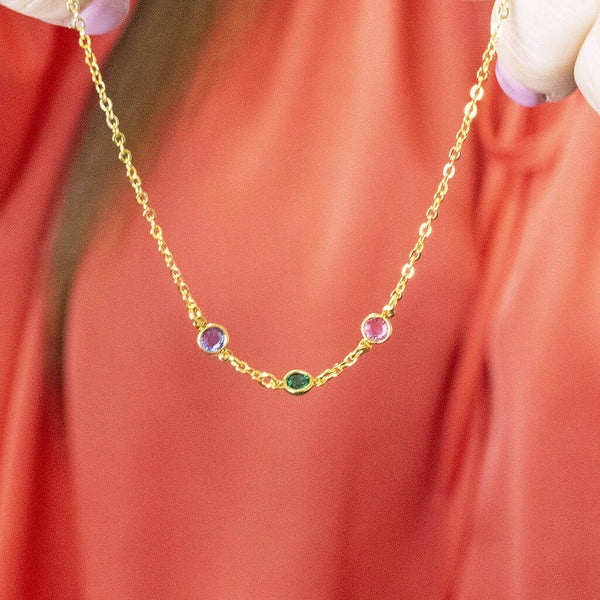 Image shows model holding Mini Gold Plated Family Birthstone Link Necklace