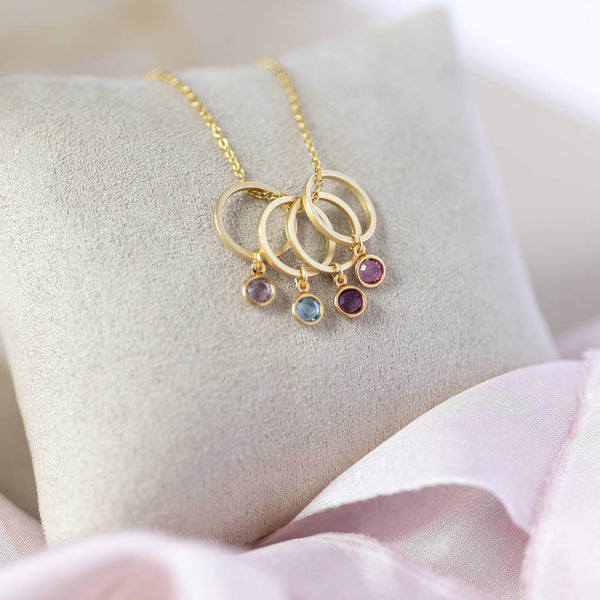 Image shows  minimalist family birthstone circle charm necklace