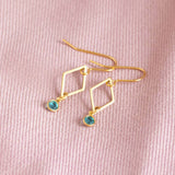 Image shows minimalist gold rhombus birthstone earrings