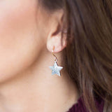 Image shows model wearing Star Sparkle Earring 