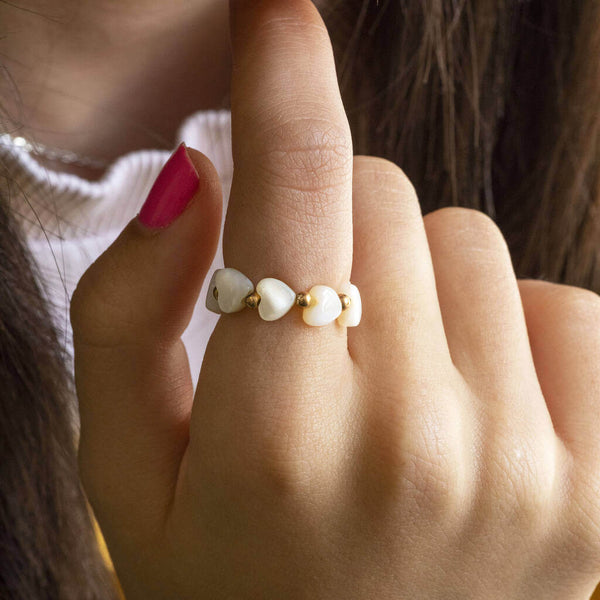 Model wears mother of pearl heart stretch ring