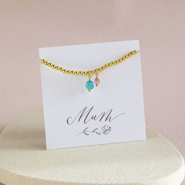 Image shows gold Mother and Child Beaded Birthstone Charm Bracelet on a Mum sentiment card