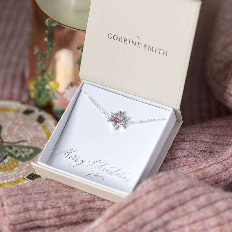 Image shows Outline Star Birthstone Bracelet in a gift box on a Merry Christmas sentiment card