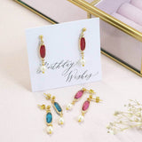 Image shows Oval Birthstone Earrings with Pearl Detail in a birthday wishes sentiment card