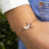 Image shows model wearing Pave Moon And Star Charm Bracelet