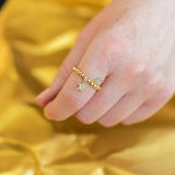 Image shows model wearing gold pave star beaded charm ring with March birthstone