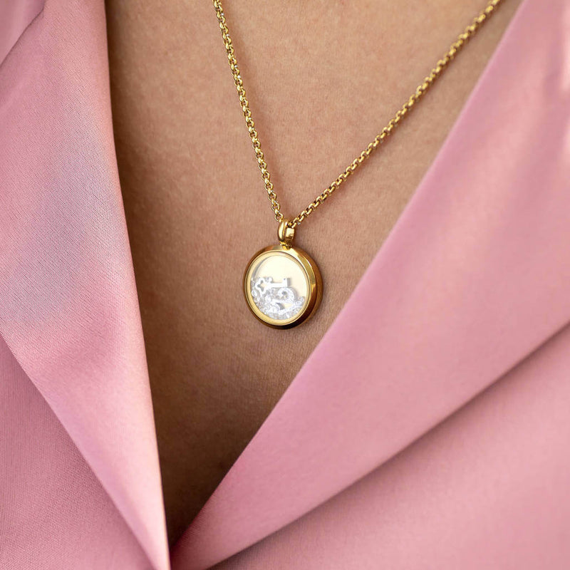Image shows model wearing gold personalised 21st birthday floating locket  
