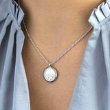 Image shows model wearing silver personalised 21st birthday floating locket 