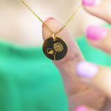 Image shows model holding Personalised Birth Flower Necklace