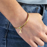Image shows model wearing personalised birthstone ring initial bracelet with the initial  A and December birthstone
