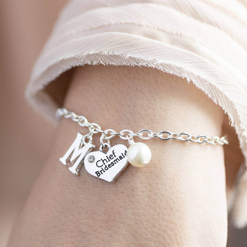 Model wears personalised bridesmaid charm bracelet 