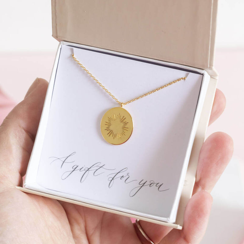 Image shows model holding personalised bright star oval necklace in gift boson a gift for you sentiment card