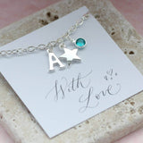 Image shows personalised Childs charm bracelet with initial A,Star charm and December birthstone
