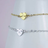 Image shows two personalised dainty heart bracelets silver and gold