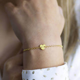 Image shows model wearing personalised dainty heart bracelet