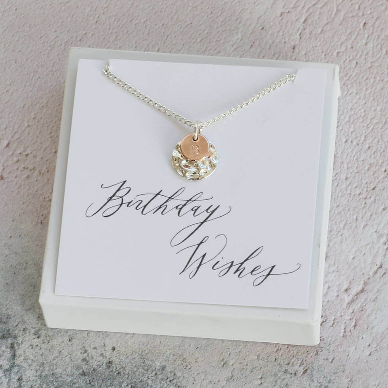 Image shows hammered disc necklace in a gift box on birthday wishes sentiment card