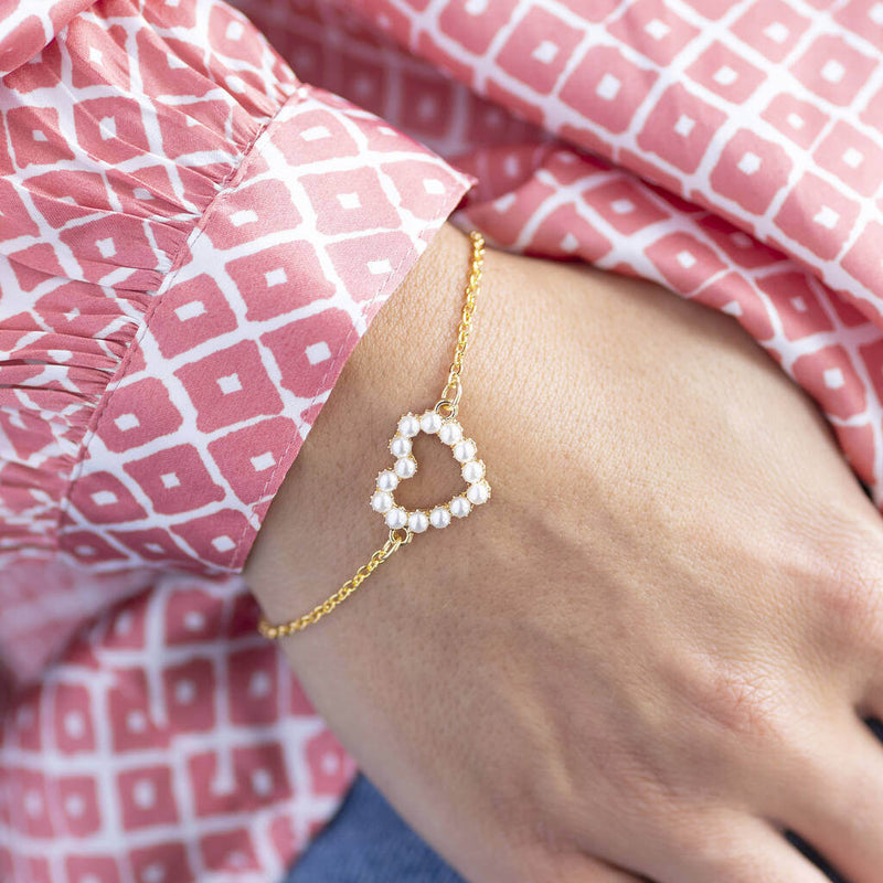 Image shows model wearing Personalised Heart Bracelet with Pearl Detail