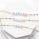 Image shows a selection of personalised name enamel chain bracelet with name Hannah,Chloe and Ava