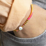 Image shows model wearing Personalised Neon Friendship Bracelet