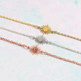 Image shows three personalised sunburst bracelets gold, silver and rose gold