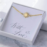 Image shows gold personalised sunburst bracelet in a gift box on with love sentiment card