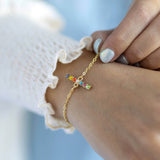 Image shows model wearing personalised vertical rainbow bar bracelet