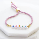 Images shows Pink Custom Name Friendship Bracelet with the name Josie